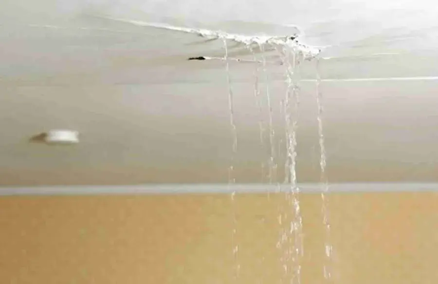 Water running from a cracked ceiling seam in a Spring Hill living room
